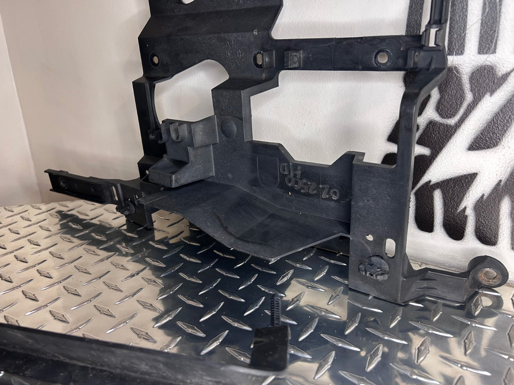 1999-02 Chevy GMC Silverado Sierra Headlight Support Bracket Pair L+R w/Pins OEM